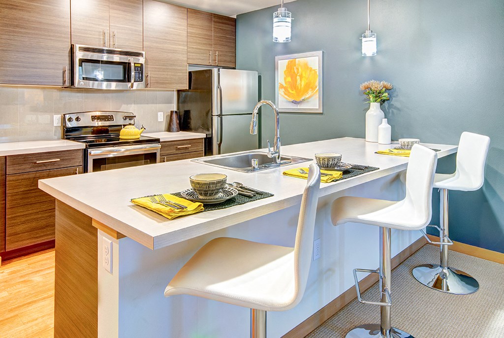 a kitchen with a counter top and a sink