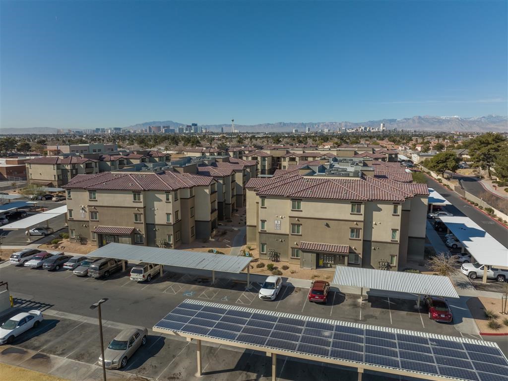 a group of buildings with solar panels on the roof