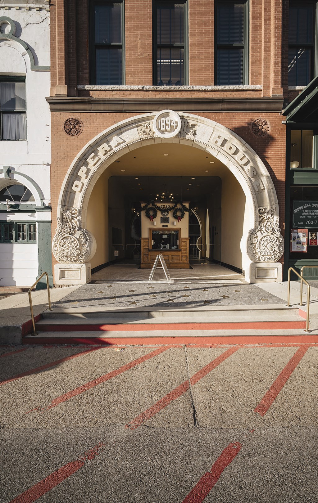 the entrance to a building with an arch