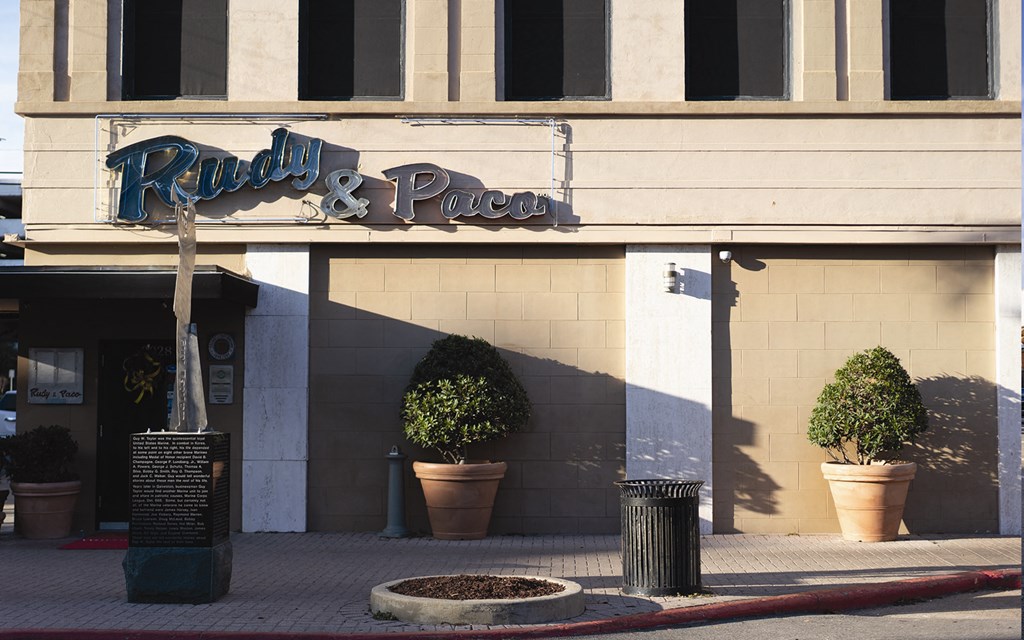 a building with a sign that reads rain  pizza