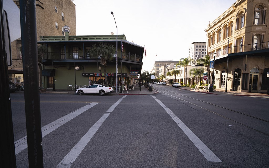 a white car parked on the side of a street