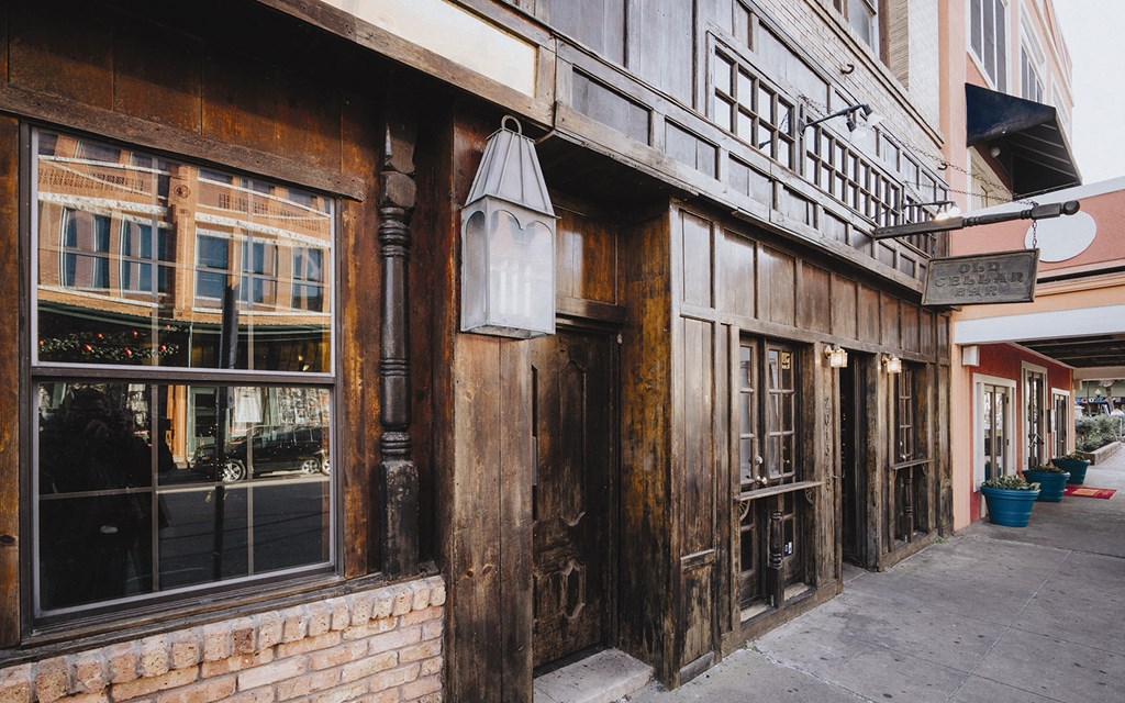 a street view of a brick building with a sidewalk