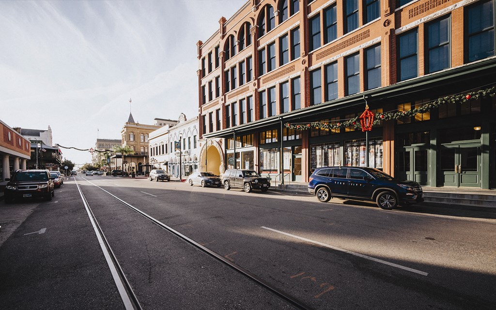 a city street with buildings and cars on it