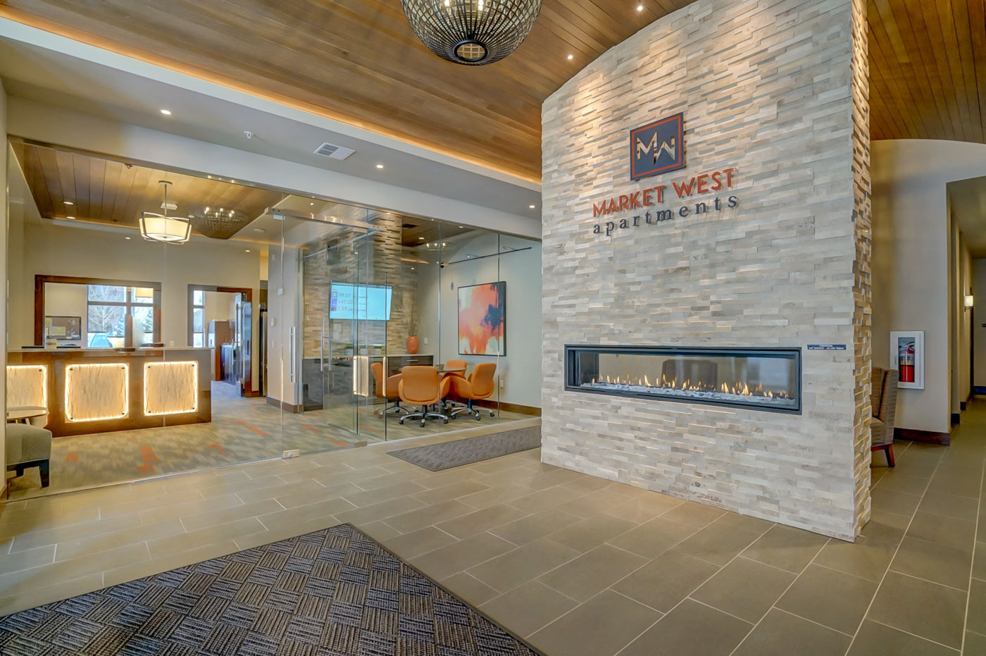 the lobby of market west apartments with a fireplace