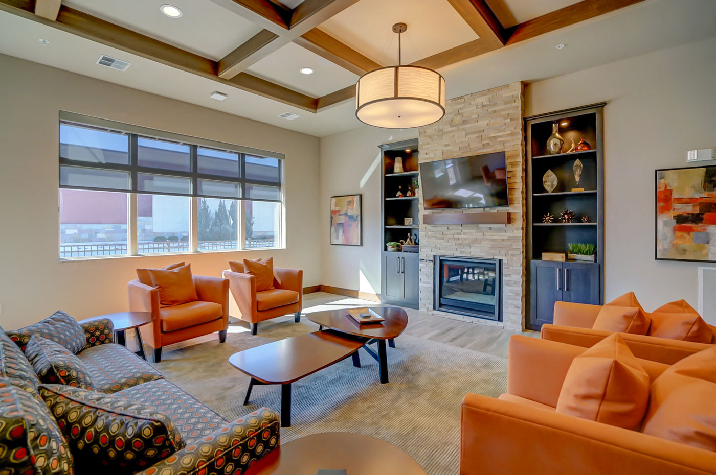 a living room with couches and chairs and a fireplace