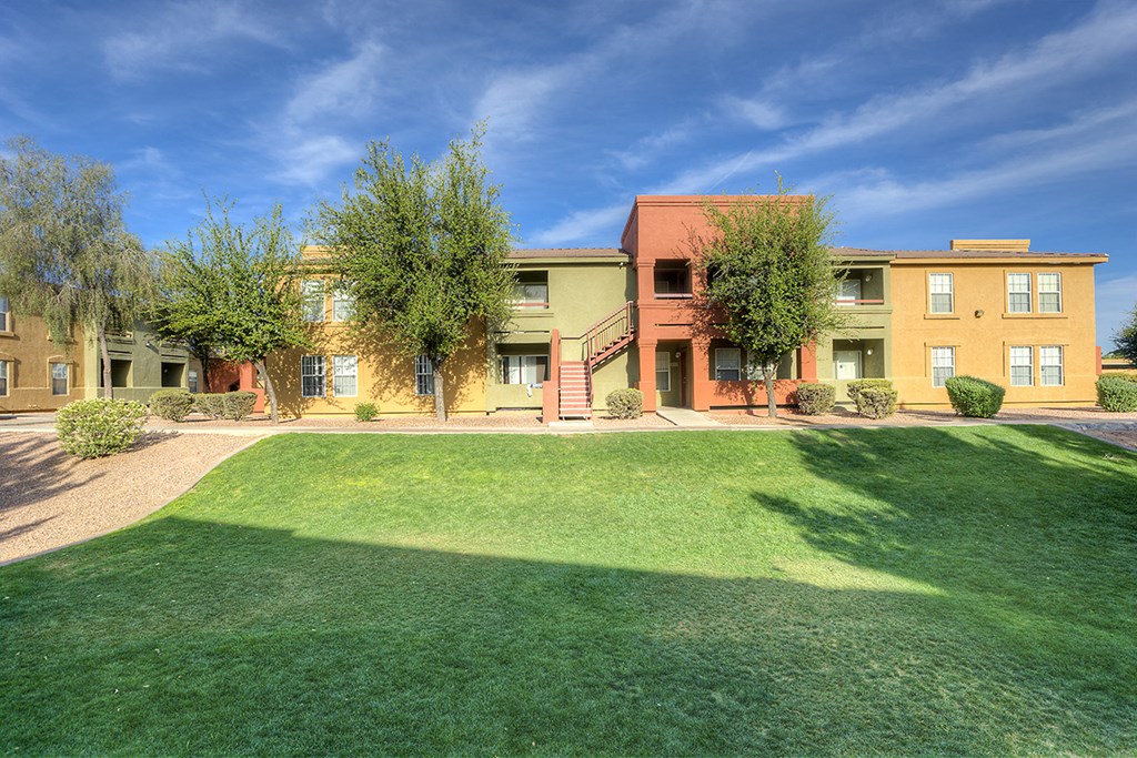a view of a yard in front of some buildings