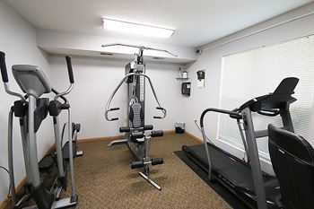 24-Hour Fitness Center with Cardio Equipment and Weights