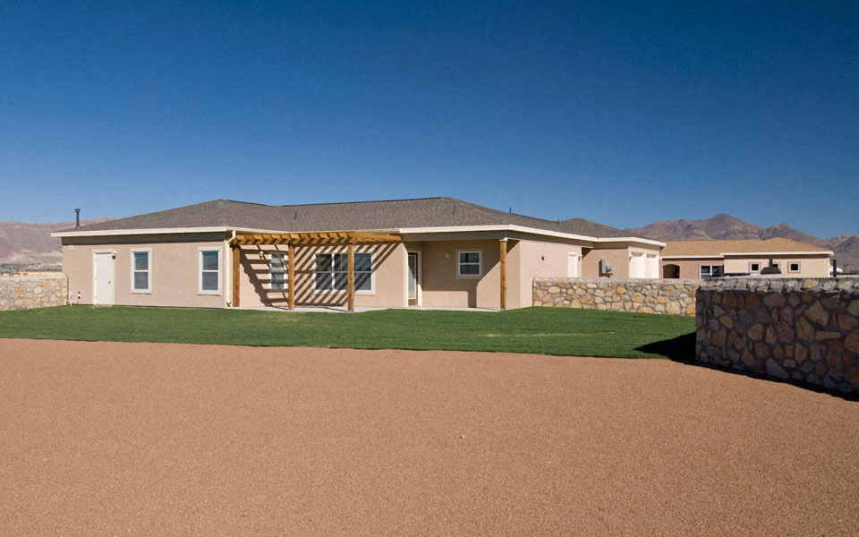 a new home with a yard and a deck