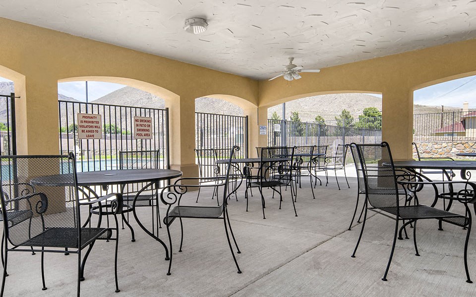 a patio with tables and chairs at a restaurant