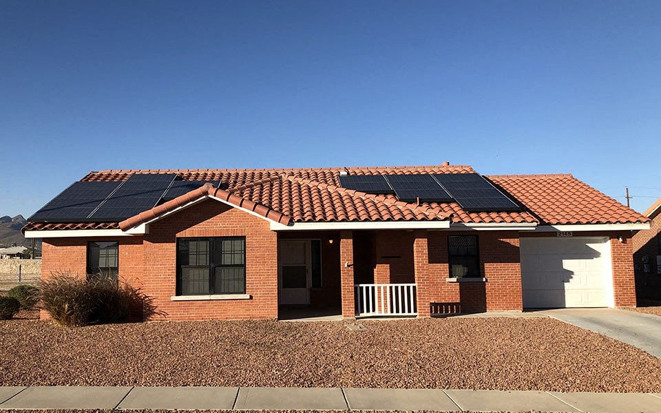 a house with solar panels on the roof