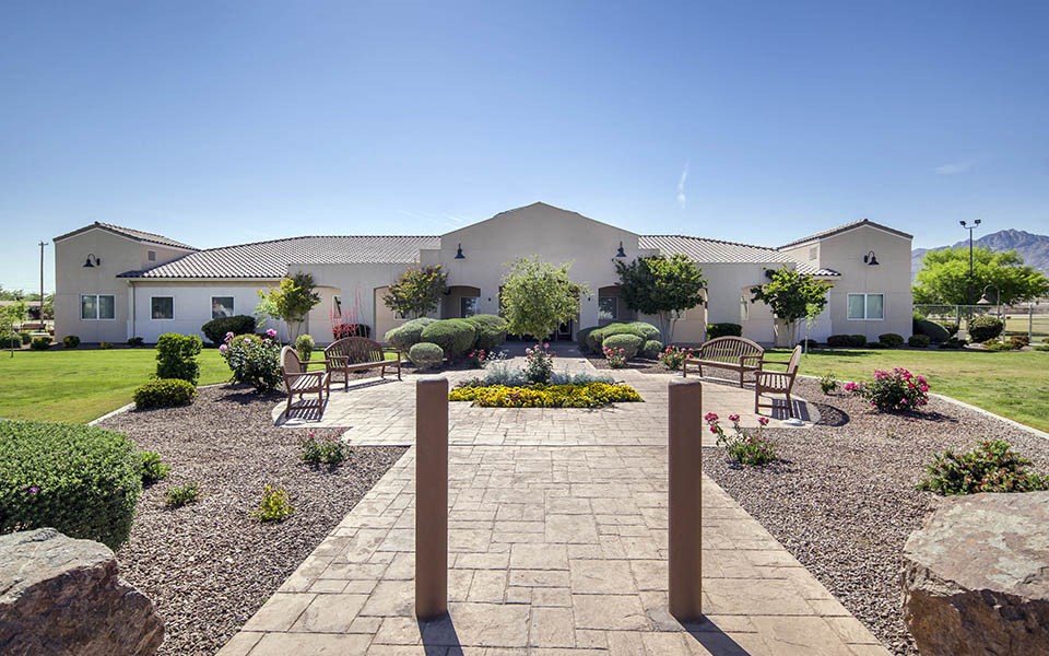 a house with a courtyard with a stone walkway