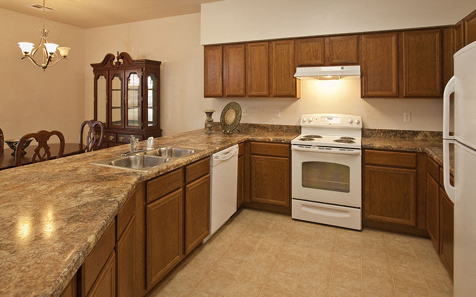 a kitchen with a counter top and a stove
