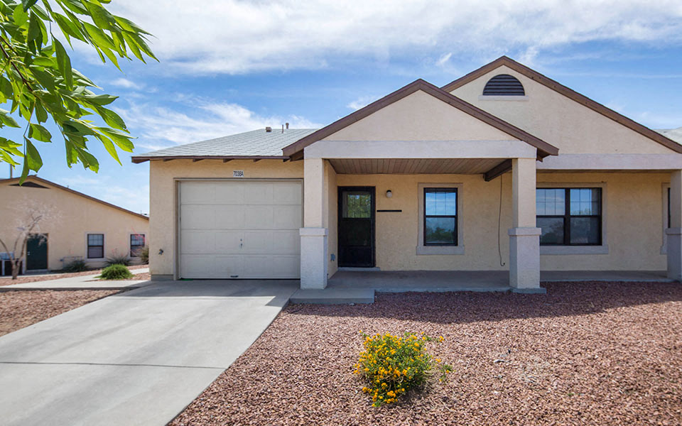 a house with a driveway and a garage door