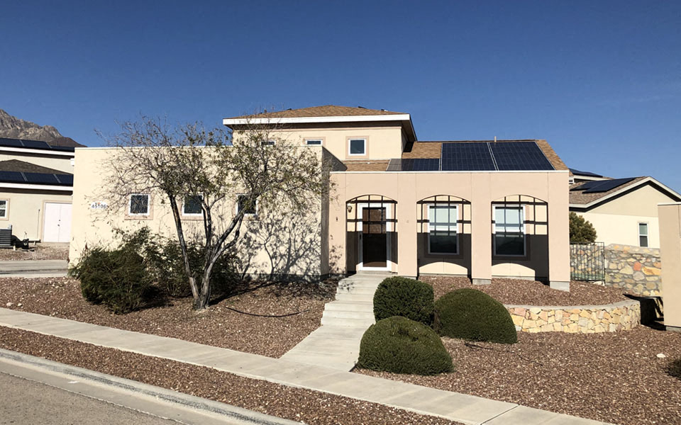 a house with solar panels on the roof