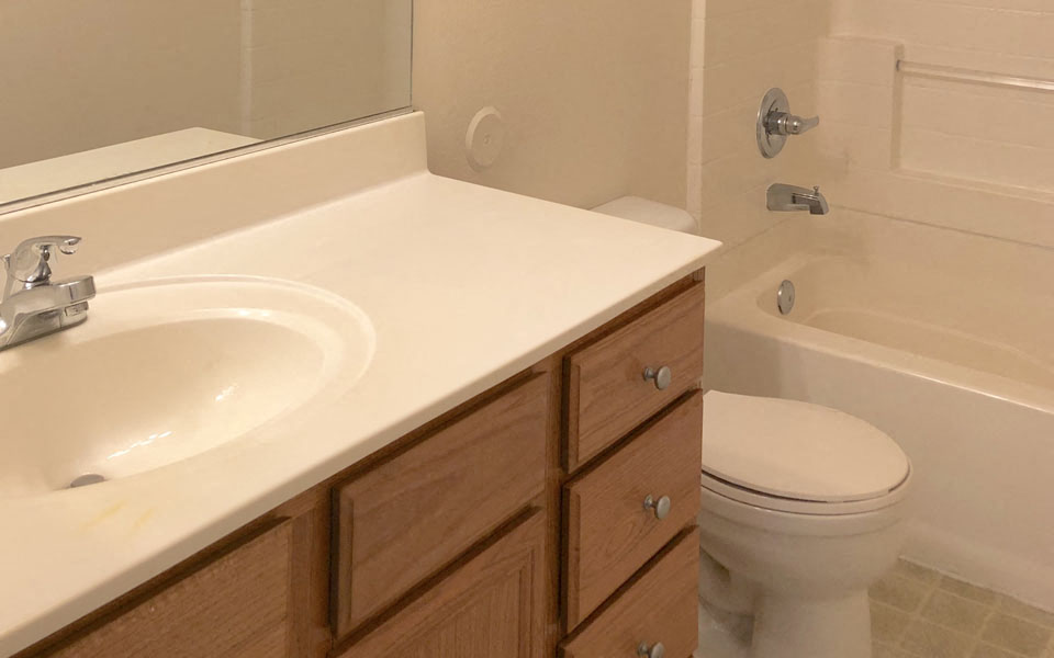 a bathroom with a sink toilet and a bath tub