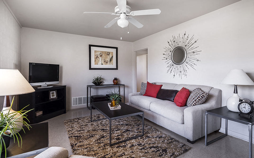 a living room with a couch and a tv
