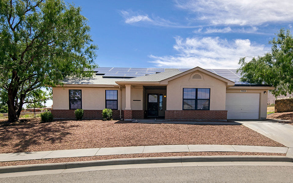 a house with solar panels on the roof
