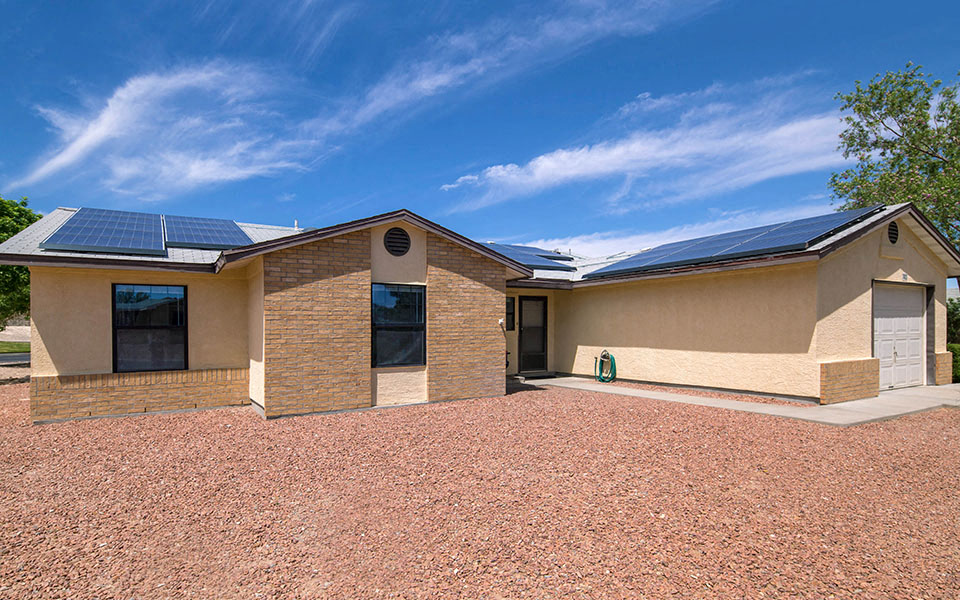 a house with solar panels on the roof