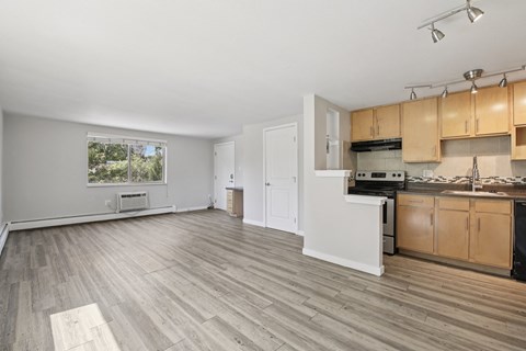 A kitchen with wooden cabinets and a white countertop.