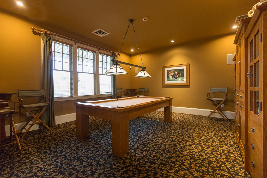 a game room with a pool table