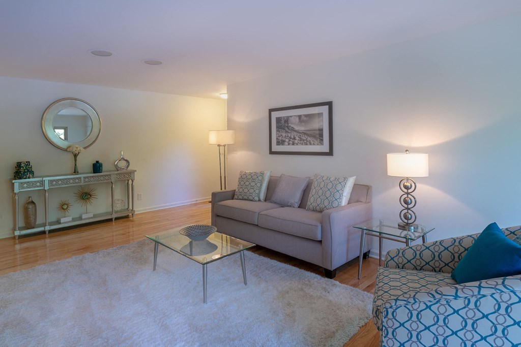 a living room with a couch and a table