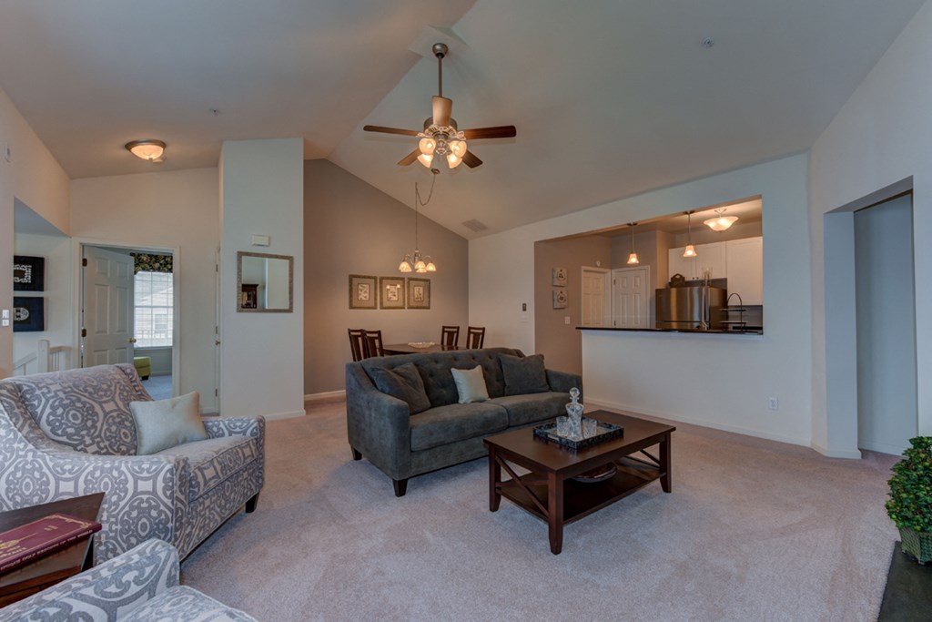 a living room with couches and a coffee table