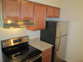 Electric Range In Kitchen at Eastwood Village Apartments, Michigan, 48035