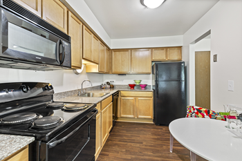 Kitchen Cabinets and Appliances at Franklin River Apartments, MI 48034