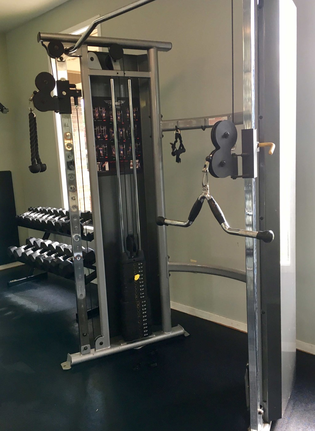 a gym with weights and other equipment in it