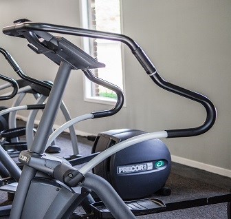 a group of exercise bikes in a room