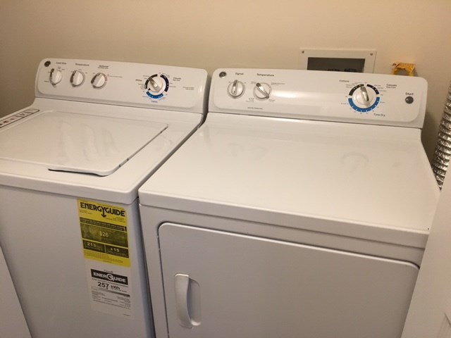 the laundry room has two washes and two dryers