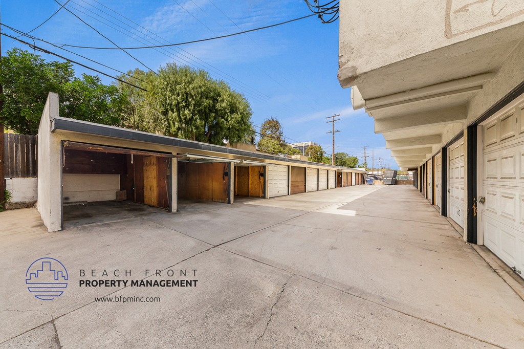 an empty parking lot at the beach from property management