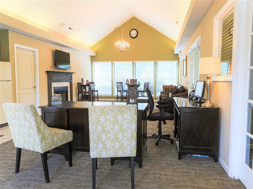 a living room and dining room with tables and chairs