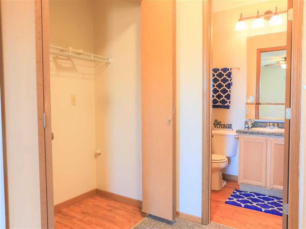 a view of a bathroom with a toilet and a mirror