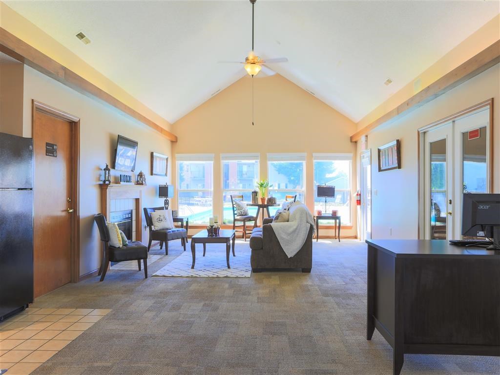 a large living room with a couch and a table