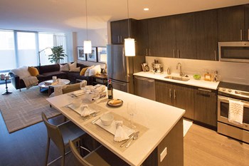Interior Kitchen and Living Room Fully Equipped Kitchens And Dining at The Benjamin Seaport Residences, Massachusetts, 02210 - Photo Gallery 5