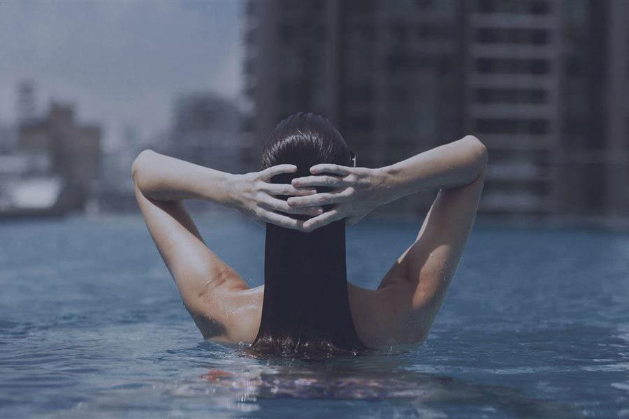 Amenities- Woman In The Pool Picture at The Benjamin Seaport Residences, Boston