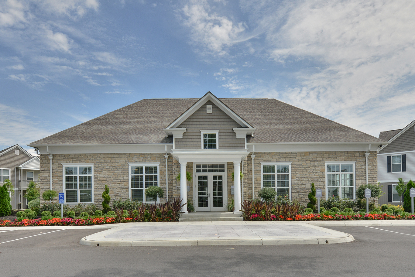 a large brick house with a driveway in front of it