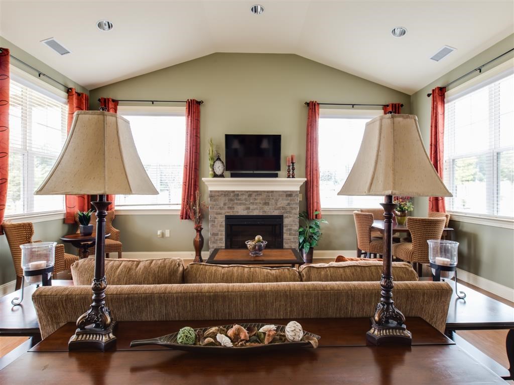 a living room with a couch and a fireplace