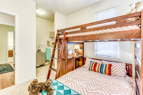 Bright secondary bedroom with comfortable furnishings, ample space, and a welcoming design suited for guests, family members, or a home office.