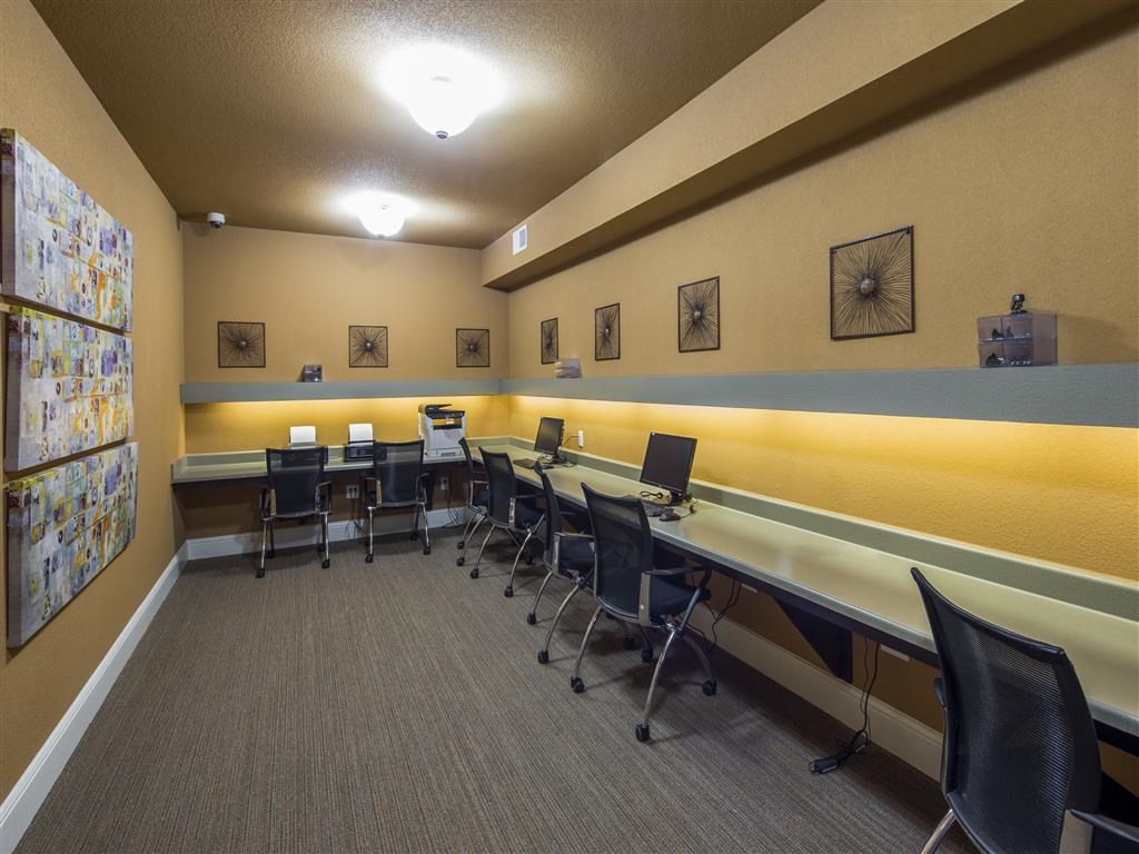 a conference room with desks and chairs