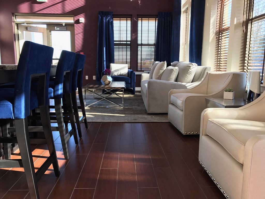 a living room with a table and chairs and a couch