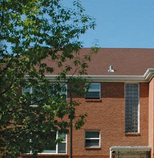 a red brick building with a white door