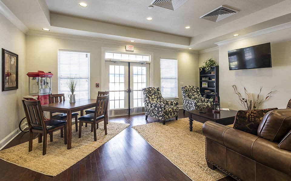 a living room with a table and a couch