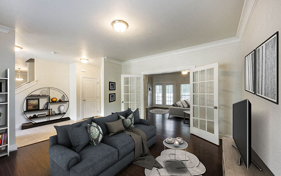 a living room with a couch and a tv