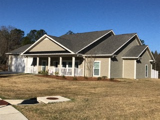 a house with a yard in front of it