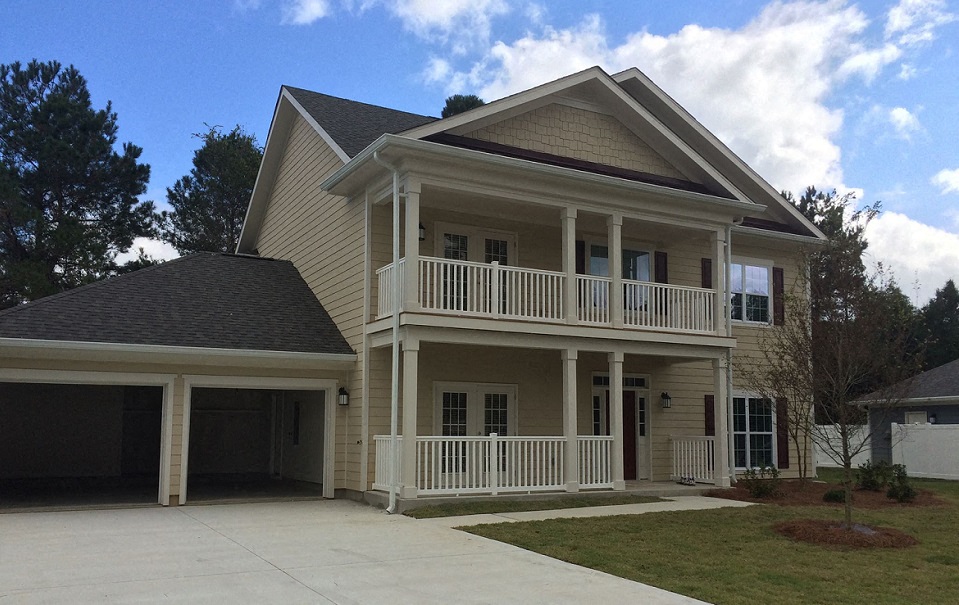 a house with a porch and a garage