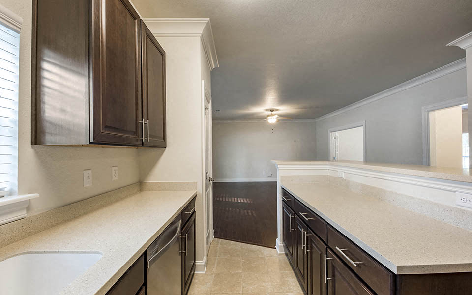 a kitchen with a counter top and a sink