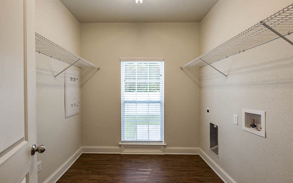 a bedroom with a closet and a window and a door