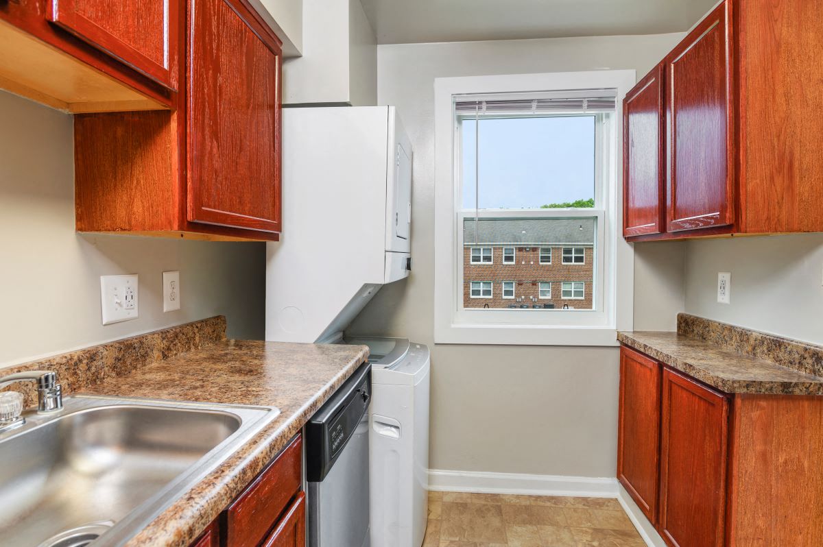 a kitchen with a sink and a window